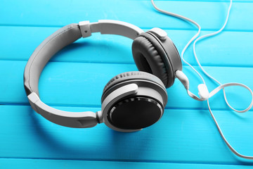 Obraz na płótnie Canvas Headphones on blue wooden background