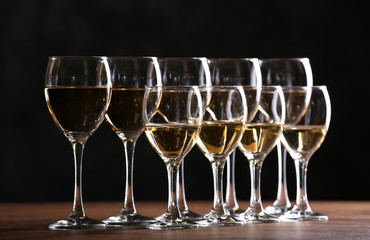 Half full wine glasses on a table