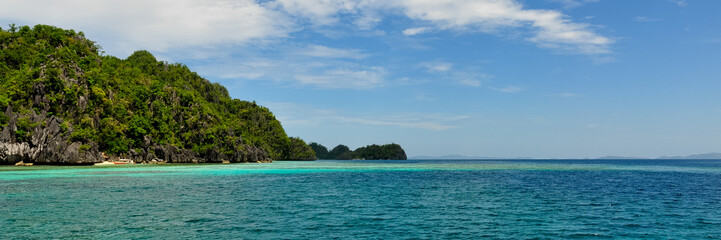 Landscape of deep blue sea and green Island