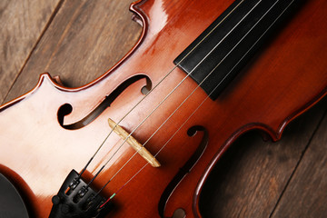 Violin on wooden background