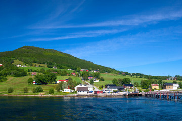 Fototapeta na wymiar View of one of the Norwegian dereve from water