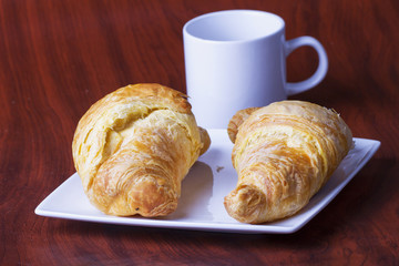 Croissants over white plate