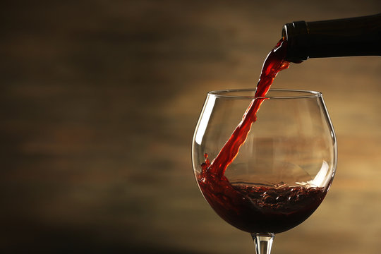 Red wine pouring in a glass