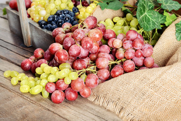 Grape in wooden box on a table