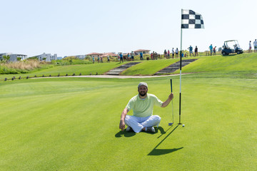 Man playing golf at club