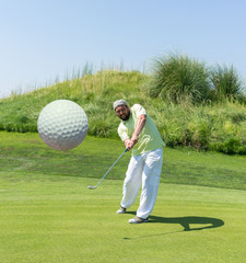 Fototapeta premium Successful man playing golf at club