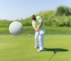Man playing golf at club