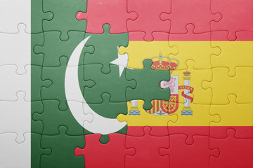 puzzle with the national flag of spain and pakistan