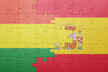Fototapeta premium puzzle with the national flag of spain and bolivia