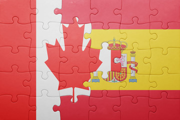 puzzle with the national flag of spain and canada