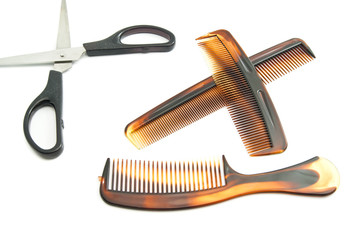 scissors and combs on white