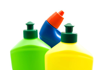 different bottles of detergent on white