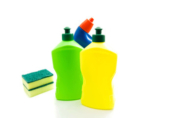 bottles of detergent and sponges on white