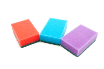 three different colored sponges