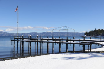 Travel: Lake Tahoe - beach with snow and flag