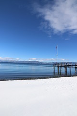 Travel: Lake Tahoe - beach with snow and flag