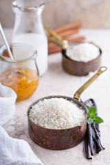 Raw rice in a measuring cup ready to be cooked