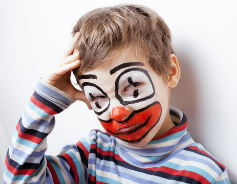 little cute boy with facepaint like clown, pantomimic expressions close up