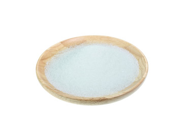 Close up of white sugar in wooden bowl isolated on white