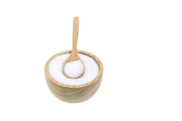 Close up of white sugar in wooden bowl isolated on white