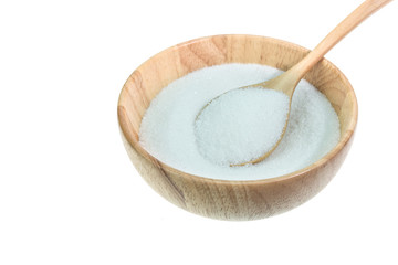 Close up of white sugar in wooden bowl isolated on white