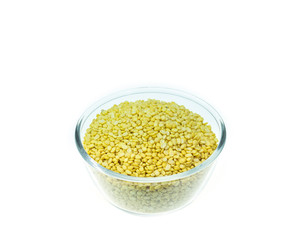 Close up peeled split mung bean in bowl isolated on white