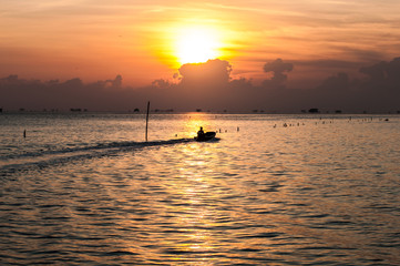 Fototapeta na wymiar light sunrise at sea fisherman's house. 