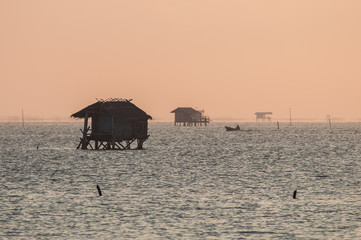 light sunrise at sea fisherman's house. 
