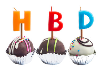 Chocolate ball in foil cup with candle