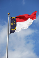 North Carolina State flag waving under sky