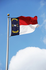 North Carolina State flag waving under sky