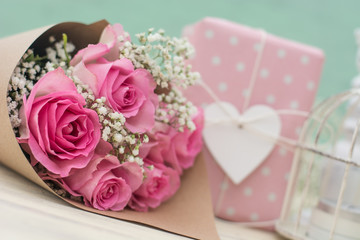 Bouquet of roses and gift