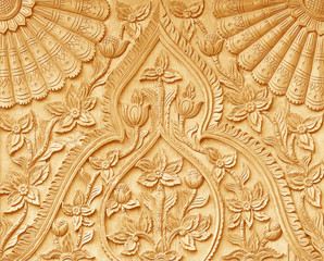 Pattern of flower carved on wood background