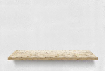 Wooden shelf on white wall
