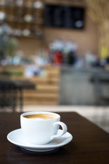 Hot art Latte Coffee in a cup on wooden table.