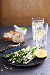 Warm salad with asparagus, feta cheese and lemon