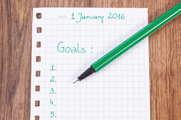 Pen and notebook for planning new years resolutions and goals