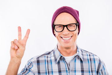 Cute senior man in glasses showing 