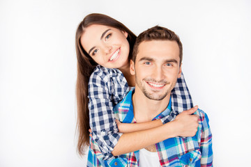 Portrait of young smiling girl hugs her boyfriend