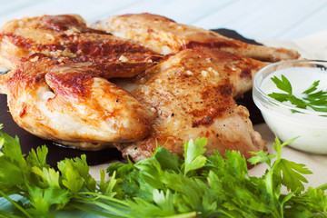 Rosted chicken on a slate plate