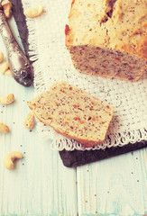 Homemade banana and nuts bread on a wooden table