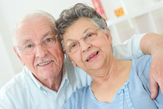 elderly couple posing