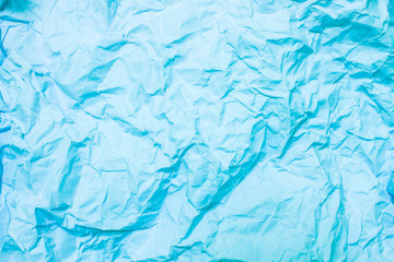 Blue crumpled paper, wrinkled paper