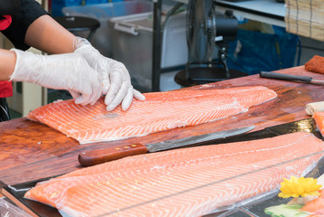 chef slicing salmon
