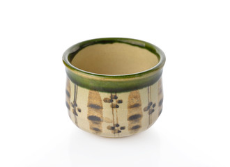 coated and painted tea cup on white background