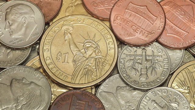 American dollar coins macro rotating swiftly under the studio lighting