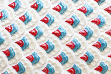 Scales of the dragon statue. Stucco surface of the animal.