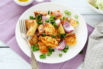 roasted potato wedges on plate