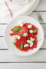 fresh summer tomato salad on plate