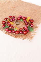 Obraz na płótnie Canvas Maroon bracelet with beads